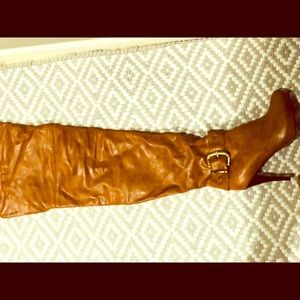 Tan Thigh high boots.